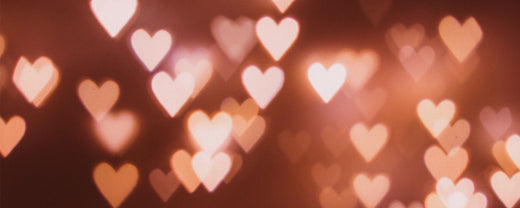 Hearts floating in the air, symbolizing Valentine's Day celebration and the theme of love and beauty.