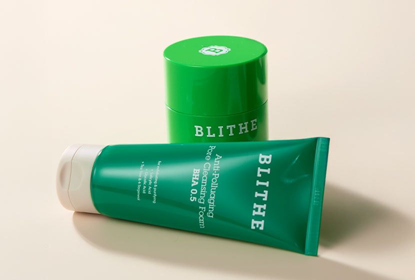 A woman holding a washcloth with makeup on it to show the power of Blithe Cosmetics natural cleansers