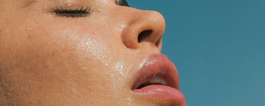 Close-up of a serene woman with eyes closed, embodying the radiant and healthy skin achievable with Blithe's specialized facial serums.