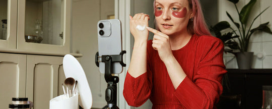 Young girl applying an eye gel mask, showcasing a moment of self-care and the importance of targeted skincare routines for youthful, radiant skin.