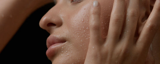Close-up of a woman with glowing, hydrated skin showcasing a healthy complexion and skincare results.