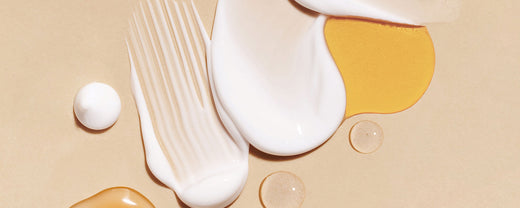 Assorted skincare products showcasing various textures: a light serum, a rich cream, a gel-based formula, and a foamy cleanser, arranged artistically to emphasize their unique properties and applications in skincare routines.