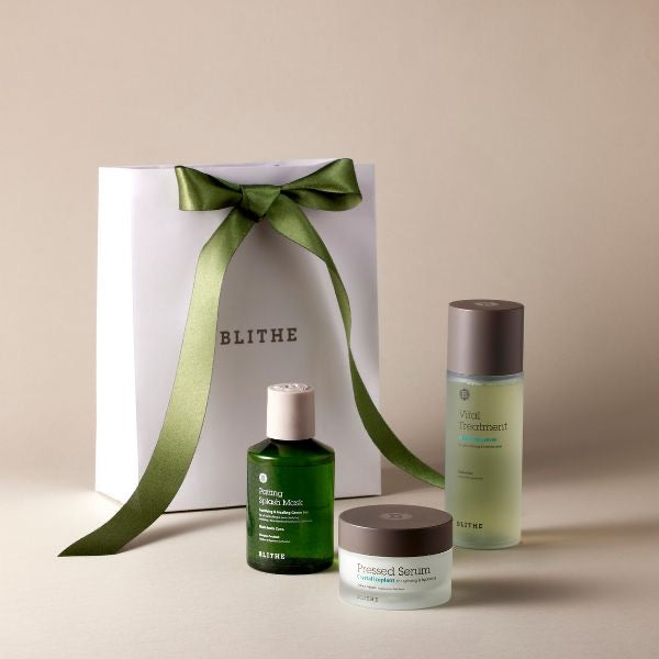 A Blithe Cosmetics skincare set beside a white gift bag
