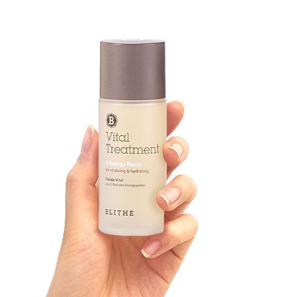  a hand holding a Vital Treatment 5 Energy Roots toner product