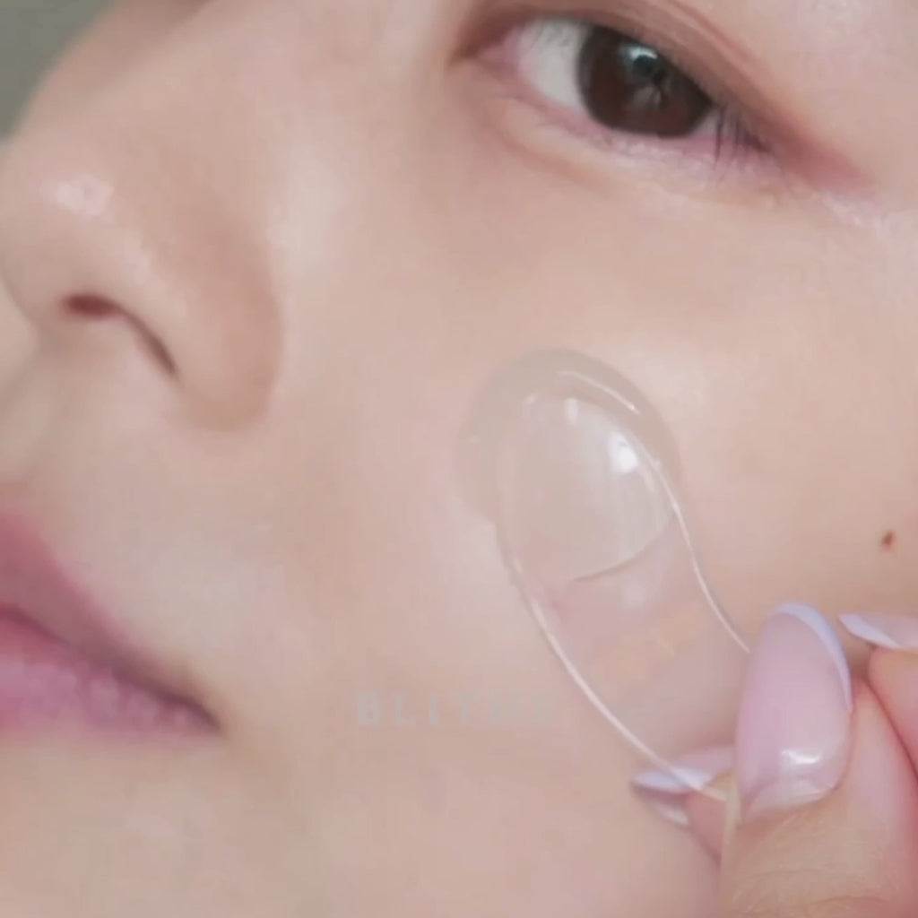 A video of a woman applying Pressed Serum Crystal Ice Plant calming skin serum
