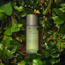 a vital treatment bottle amongst plants and leaves